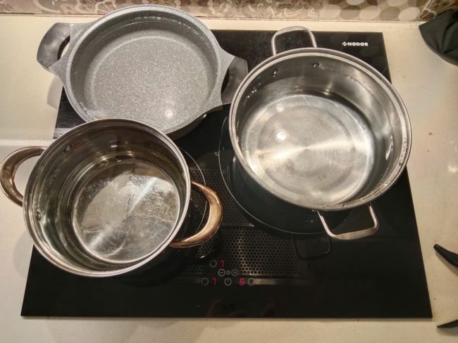 thay mặt kính bếp từ nodor chính hãng