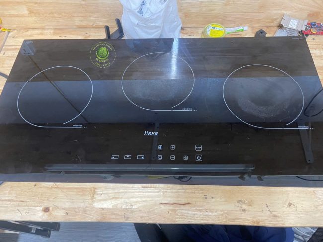 thay mặt kính bếp từ uber chính hãng